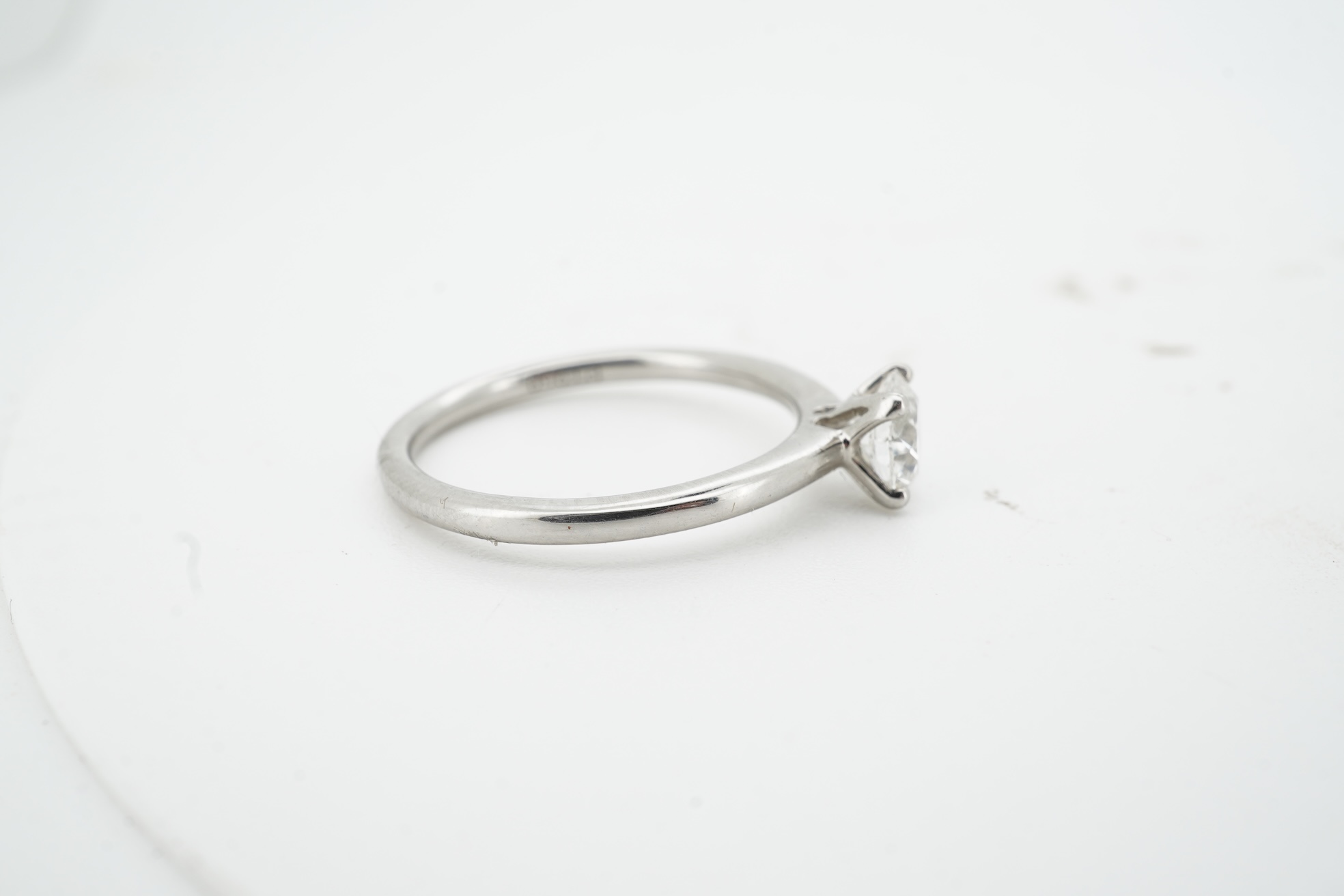 A diamond ring, claw-set with a brilliant-cut diamond weighing approximately 0.52 carats, mounted in platinum, size L1/2, British hallmarks, gross weight approximately 3 grams